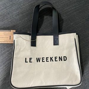 A Santa Barbra canvas tote with the saying LE WEEKEND